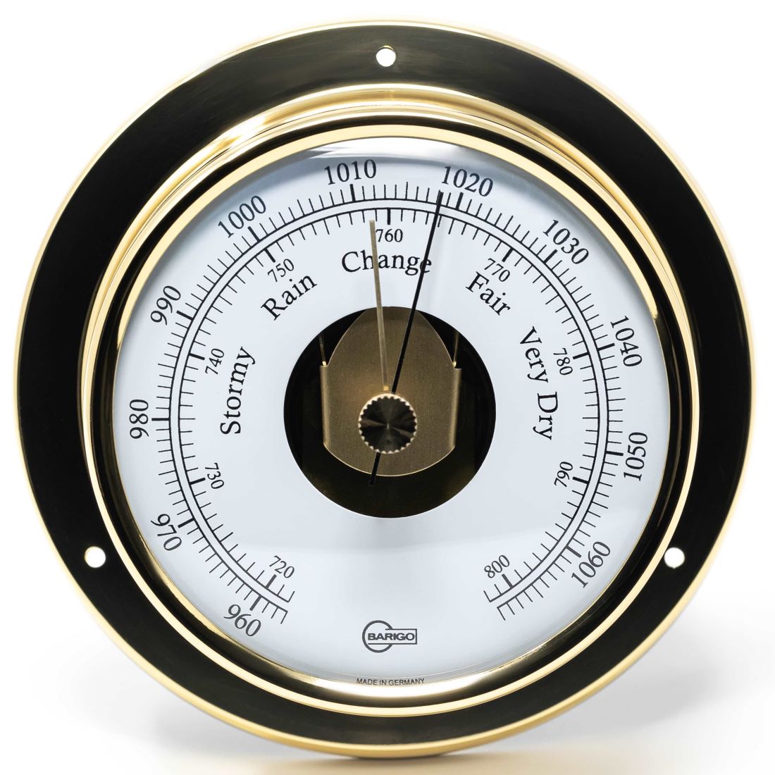 Brass analog barometer with weather indicators for measuring atmospheric pressure.