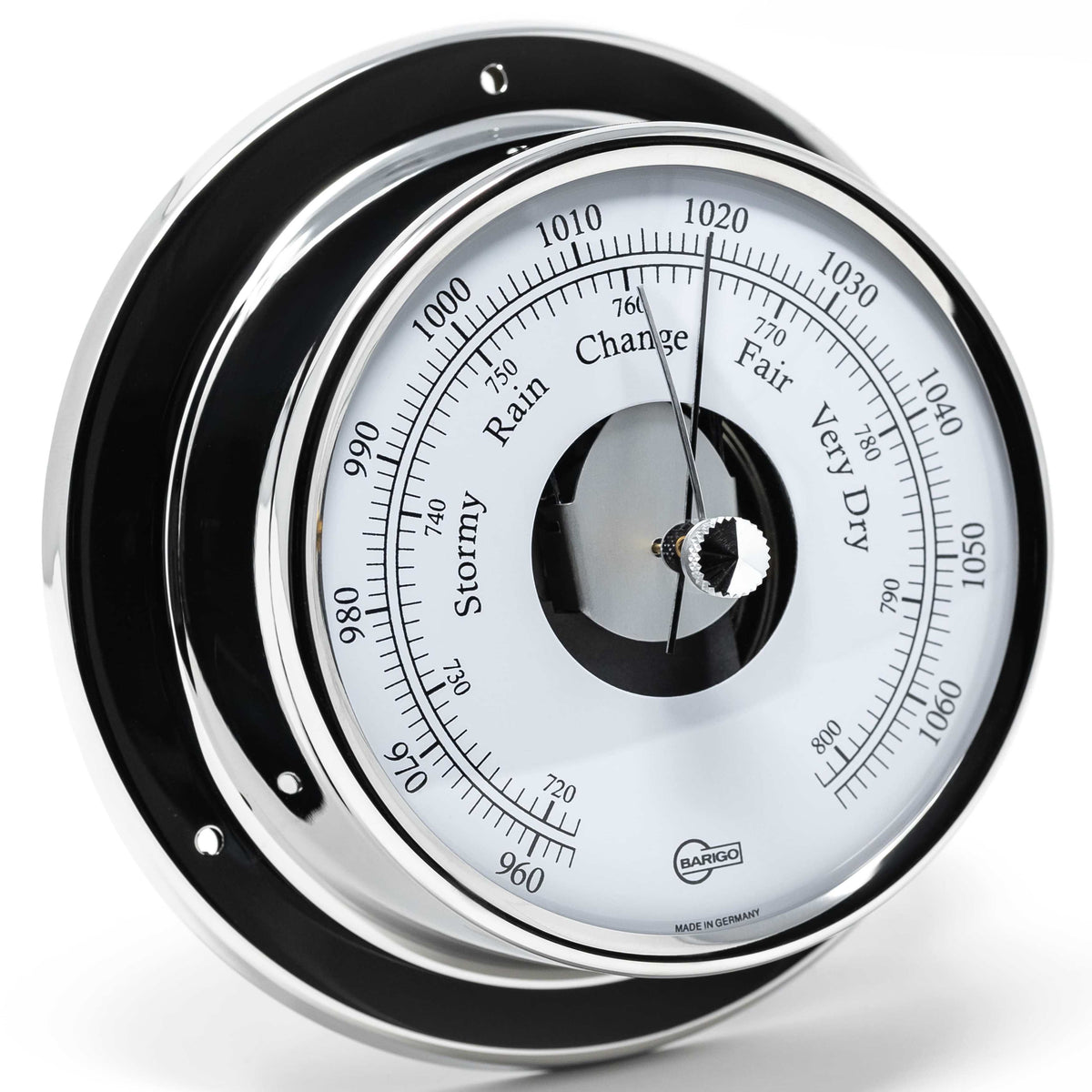 Wall-mounted German barometer with chrome finish, weather dial, and pressure readings.