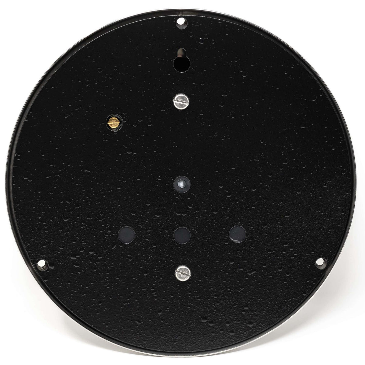 Back view of black round barometer or wall clock with mounting holes and condensation