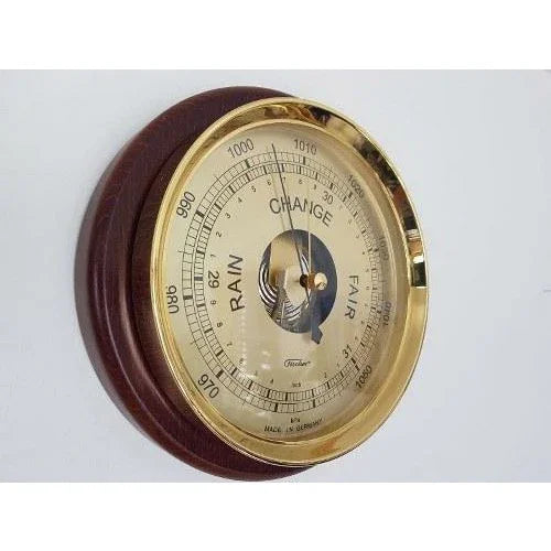 Analog wall barometer with gold trim and wooden base, weather instrument for home