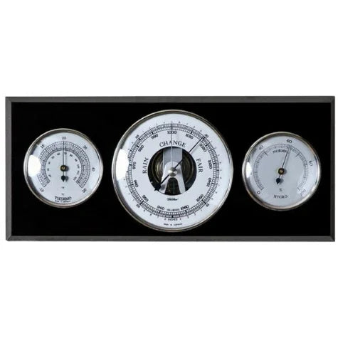 German weather station with barometer, hygrometer, and thermometer on black panel