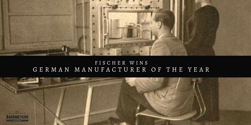 Vintage photo of two people at a weather instrument testing station, Fischer wins German Manufacturer of the Year.