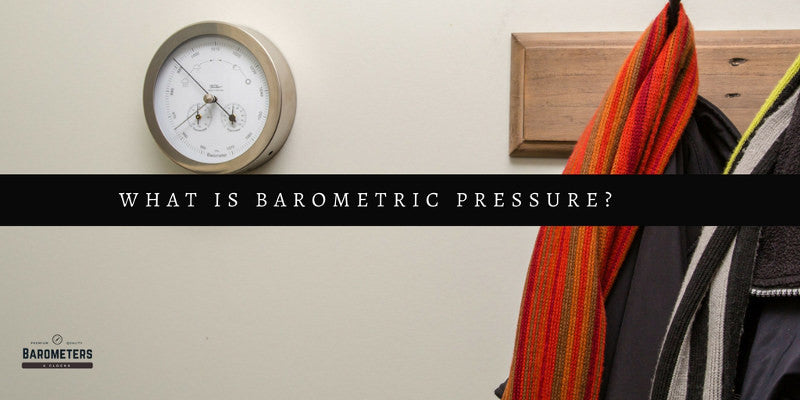 Wall-mounted analog barometer with coats hanging, barometric pressure measurement concept