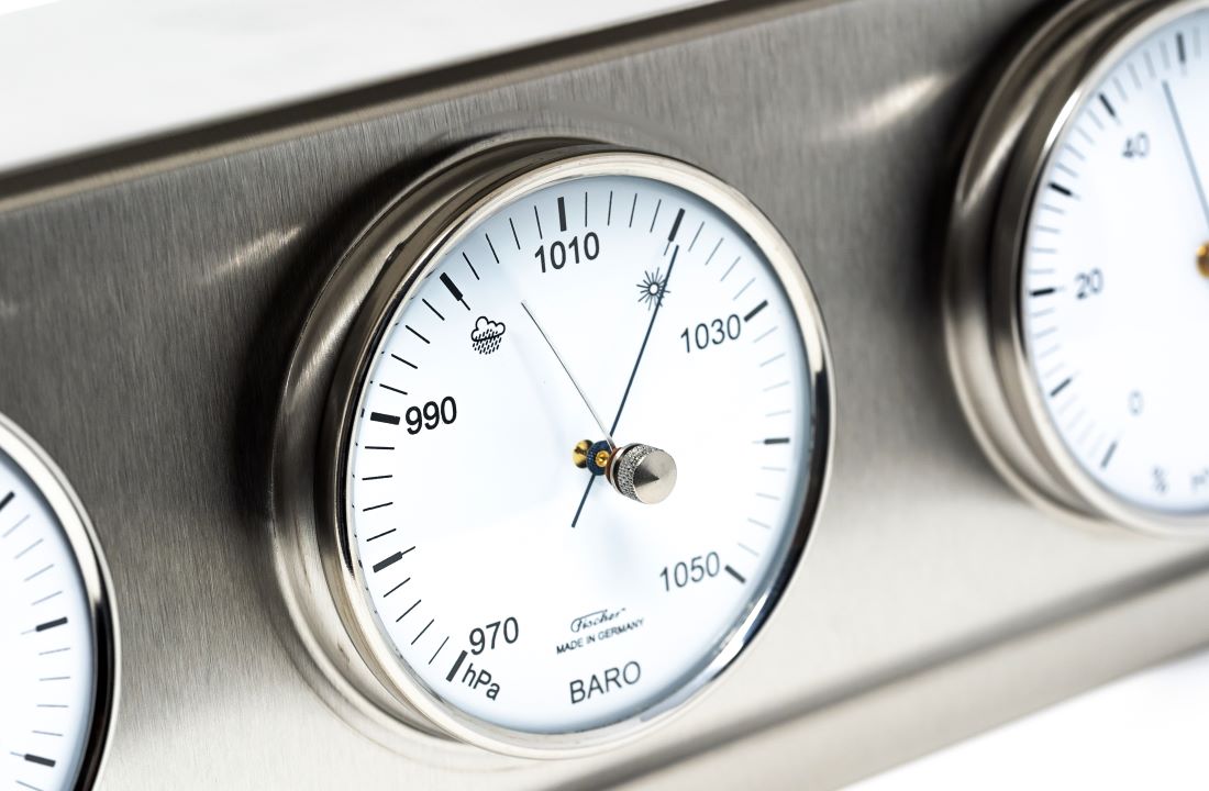 Barometric pressure gauge on a metallic panel