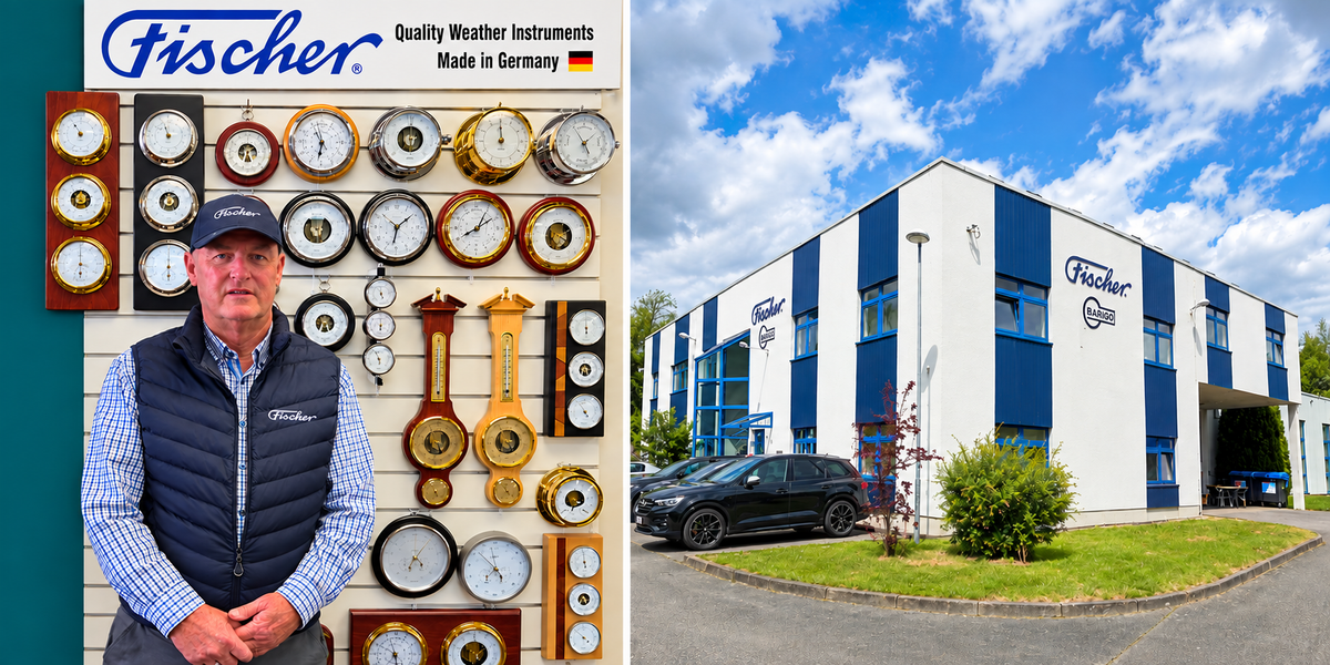 Cameron in front of a wall of Fischer instruments, beside the Fischer factory in Germany