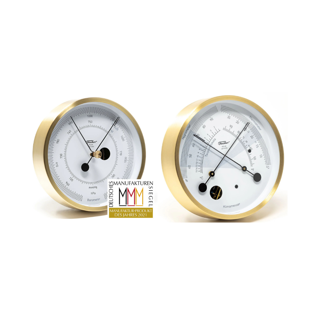 Two brass barometers on a white background with a brand logo.